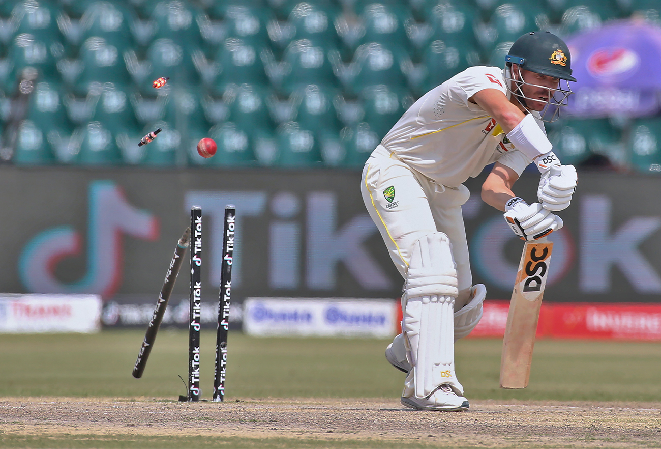 Australia's David Warner is bowled by Pakistan Shaheen Shah Afridi on the fourth day of the third test match between Pakistan and Australia in Lahore, Pakistan, on March 24, 2022. (AP)