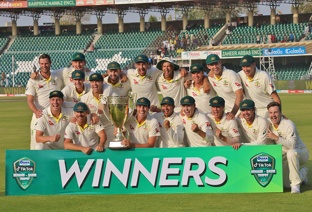 Australian team poses for the trophy after defeating Pakistan in the third Test match in Lahore, Pakistan, on March 25, 2022. (PCB/Twitter)