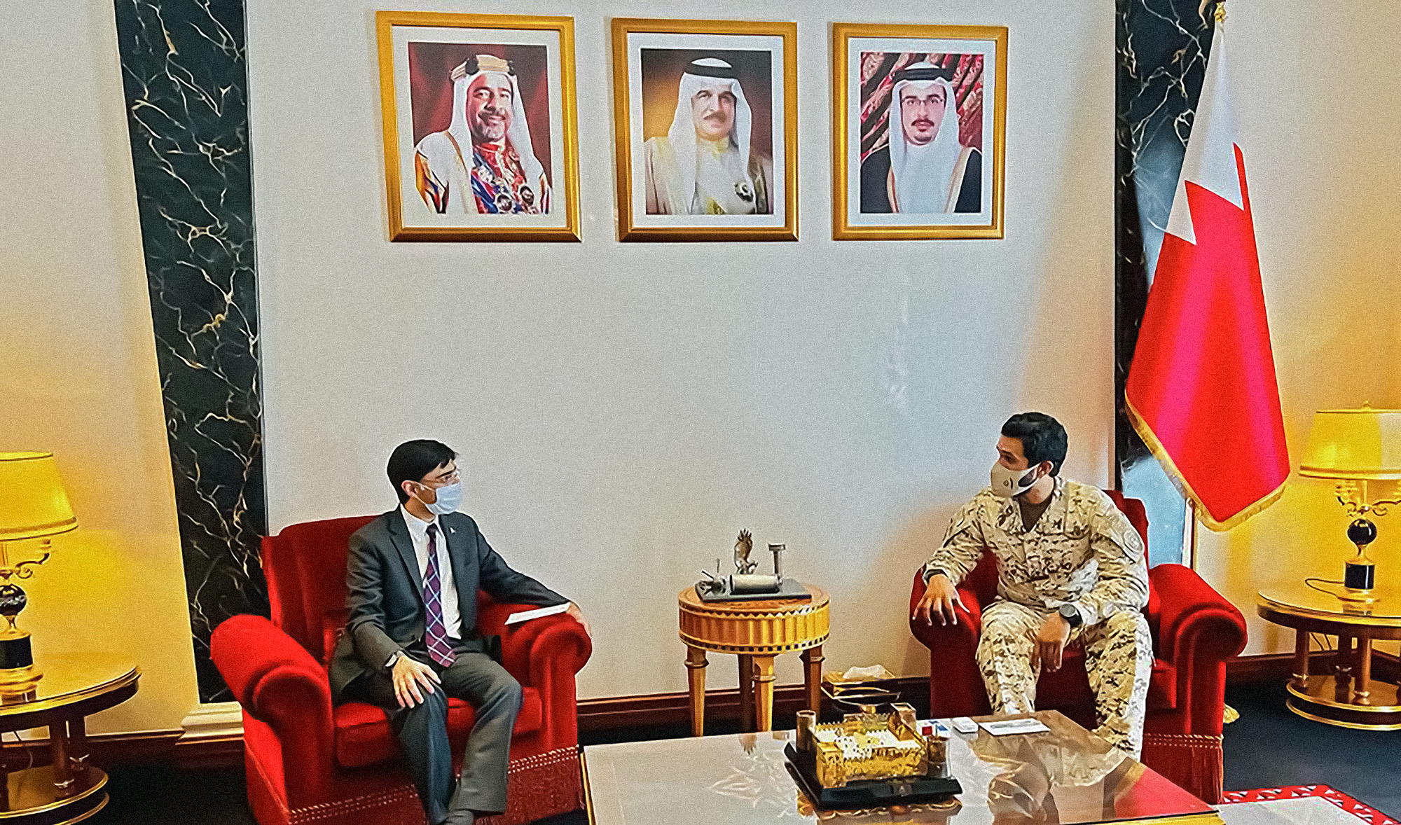 Pakistan's National Security Adviser Moeed Yusuf, left, meets his Bahrain counterpart, Sheikh Nasser bin Hamad Al-Khalifa, in Manama on March 26, 2022. (Photo courtesy: @YusufMoeed/Twitter)