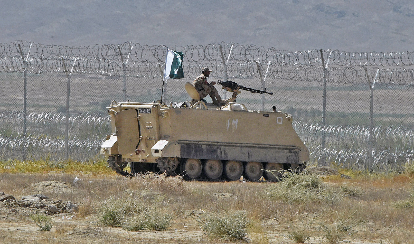 Pakistani security personnel stands on an armored vehicle near a border crossing point between Pakistan and Afghanistan at the Pakistan's border town of Qila Saifullah, Balochistan, on September 16, 2020. (AFP/File)