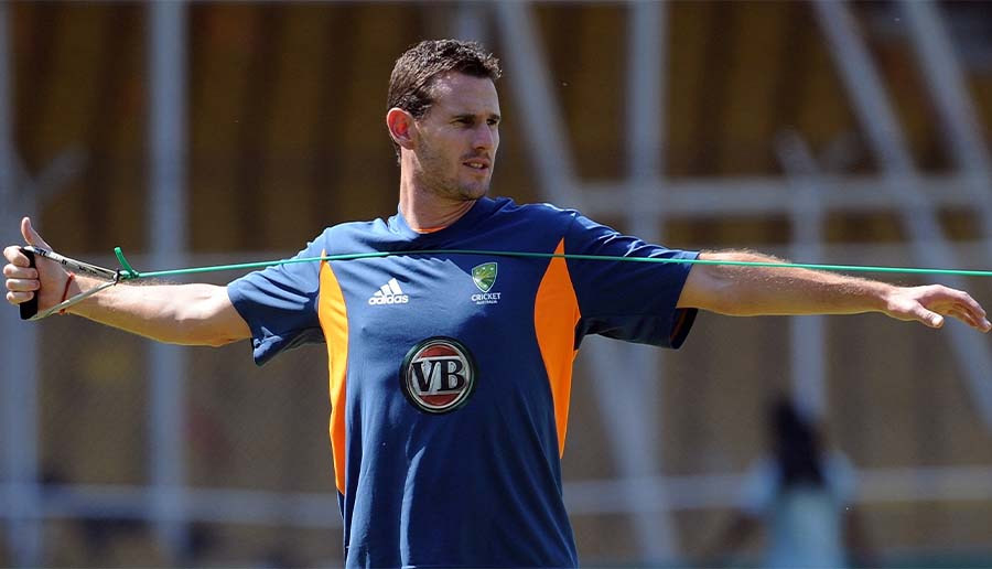 Australia bowler Shaun Tait stretches during a training session at The Sardar Patel Stadium, Motera in Ahmedabad on March 22, 2011. (AFP/FILE)
