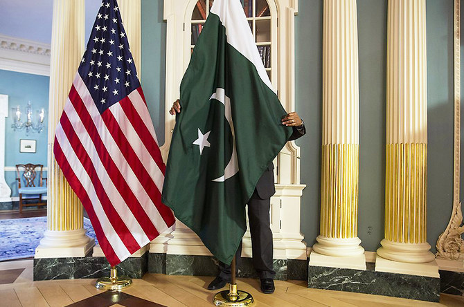 A State Department contractor adjusts Pakistan national flag before a meeting at the State Department in Washington on February 19, 2015. (REUTERS/File)