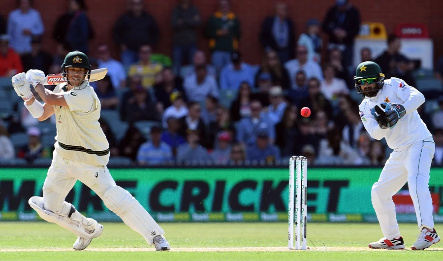Australia's batsman David Warner (L) plays a shot as Pakistan's wicketkeeper Mohammad Rizwan looks on during the second cricket Test match between Australia and Pakistan in Adelaide on Nov 30, 2019. (AFP/FILE)