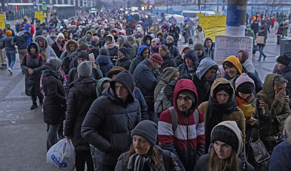 Refugees queue for trains to Poland following the Russian invasion of Ukraine, at the train station in Lviv, Ukraine, on March 7, 2022. (REUTERS)