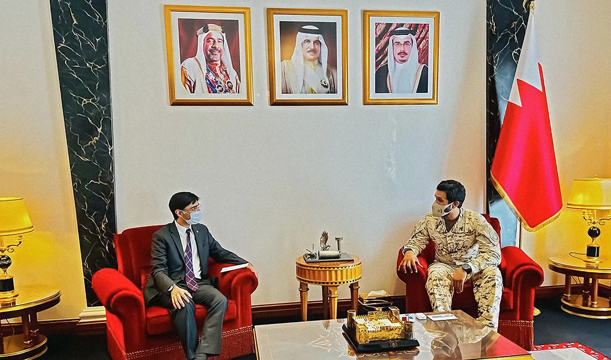 Pakistan's National Security Adviser Moeed Yusuf, left, meets his Bahrain counterpart, Sheikh Nasser bin Hamad Al-Khalifa, in Manama on March 26, 2022. (Photo courtesy: @YusufMoeed/Twitter)