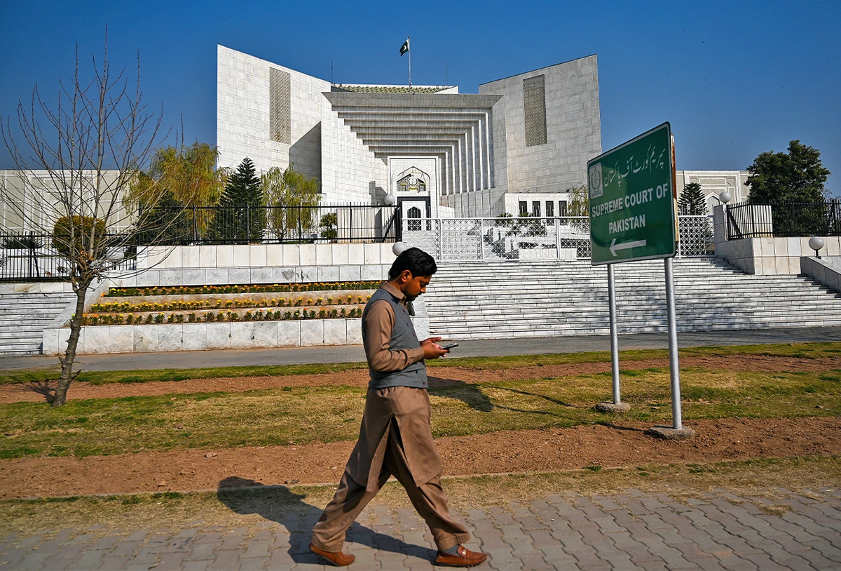 A man walks past the Supreme Court building in Islamabad, Pakistan, on January 29, 2021. (AFP/File)
