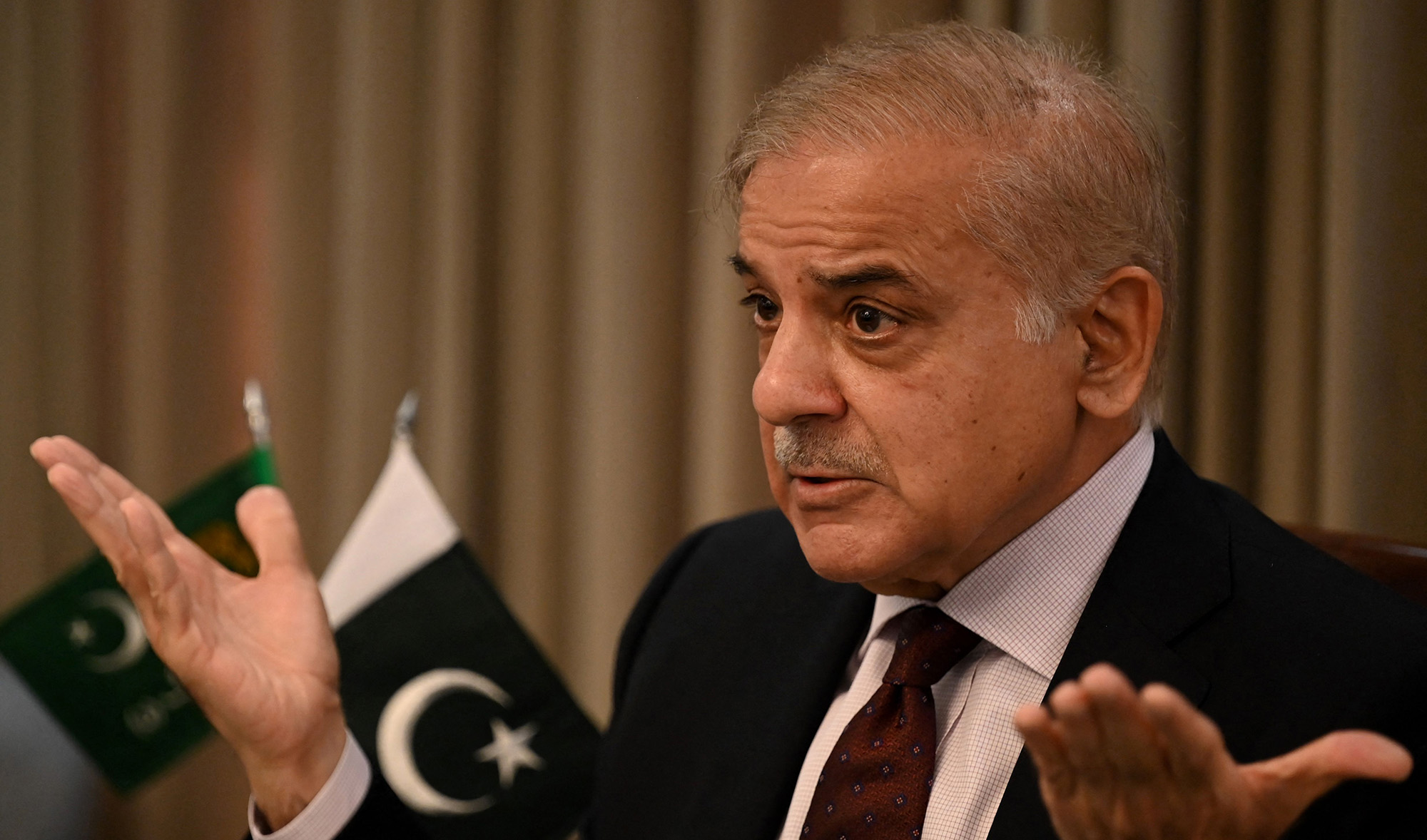 Pakistan's opposition leader Shehbaz Sharif gestures as he speaks during a news conference in Islamabad on April 1, 2022. (AFP)