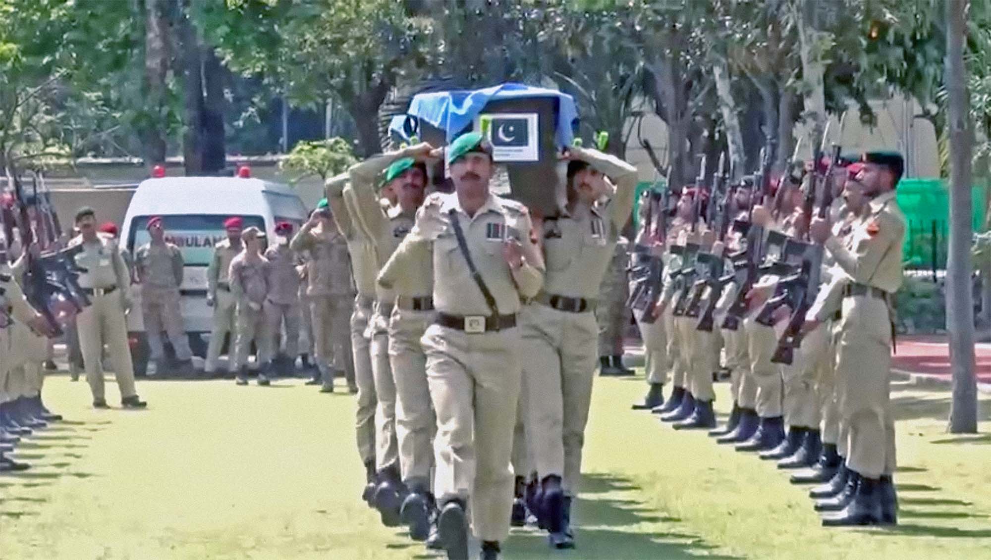Pakistani soldiers march during a funeral procession on April 3, 2022, for Pakistani UN peacekeepers who died in a helicopter crash in Congo earlier this week. (Photo courtesy: ISPR)