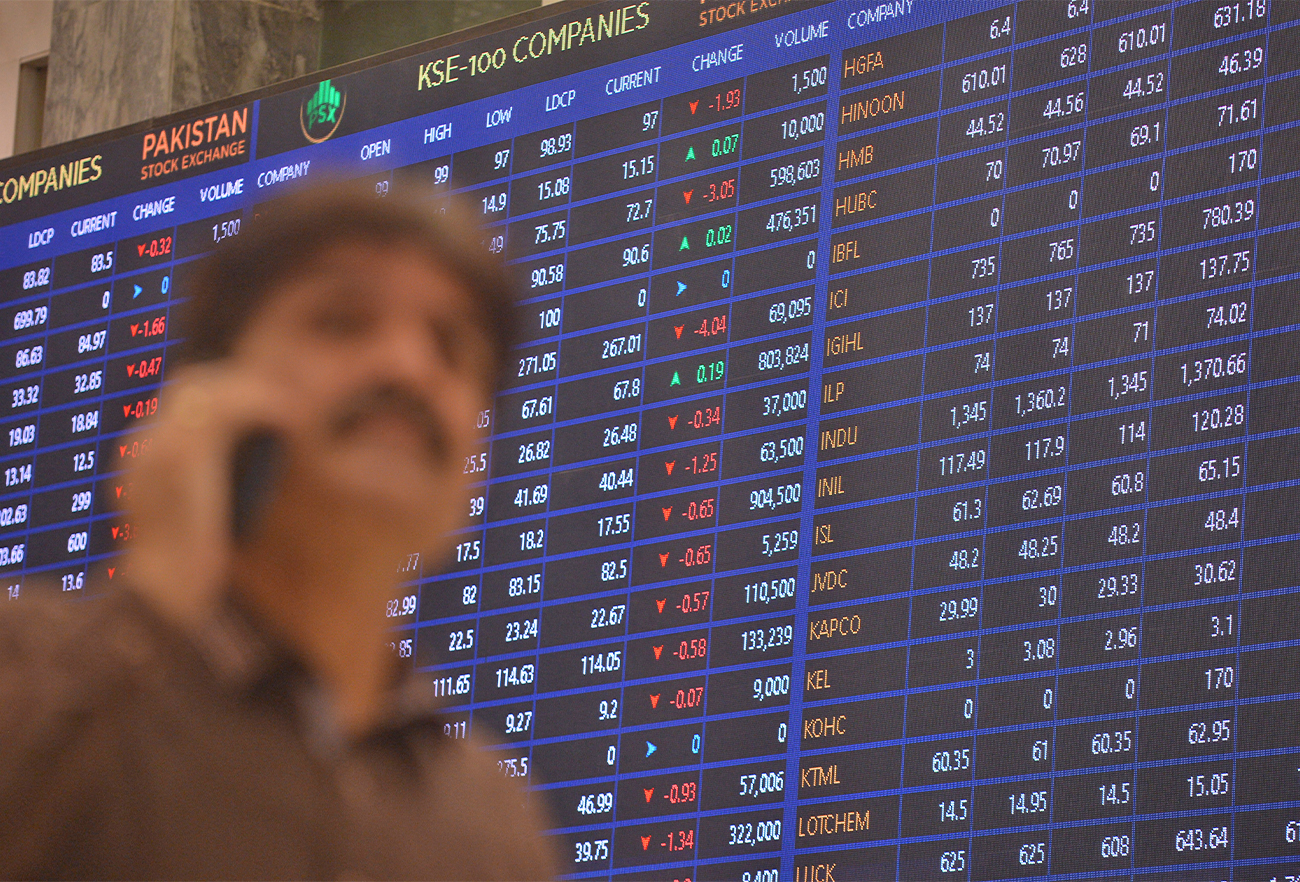 A stockbroker speaks on the phone during a trading session at the Pakistan Stock Exchange in Karachi, Pakistan, on April 4, 2022. (AFP)