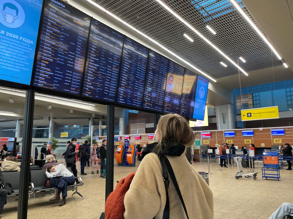 A passenger looks at a departures board at Sheremetyevo airport in Moscow, Russia February 28, 2022. (REUTERS)