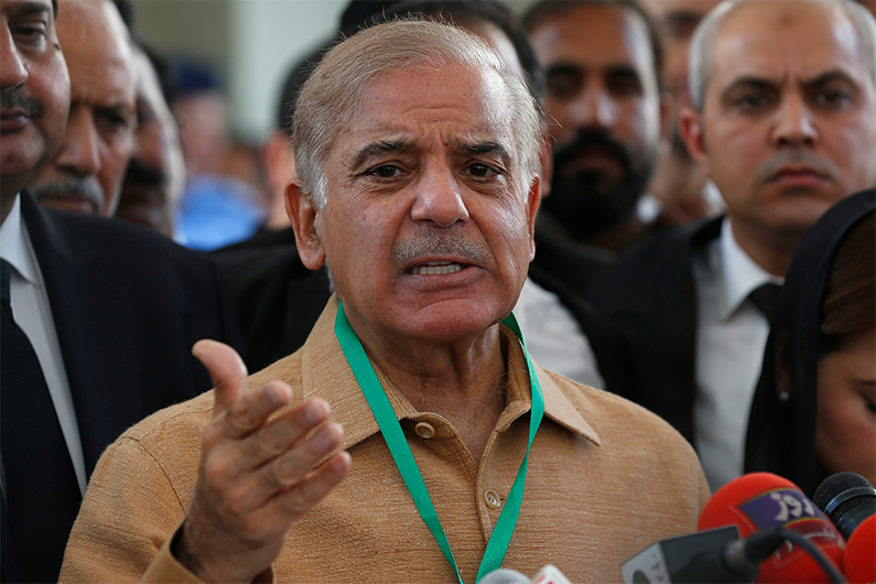 Pakistan's opposition leader Shahbaz Sharif talks to reporters outside the Supreme Court prior to a petition hearing for dissolving parliament by country's Prime Minister in Islamabad, Pakistan, April 5, 2022. (AP)