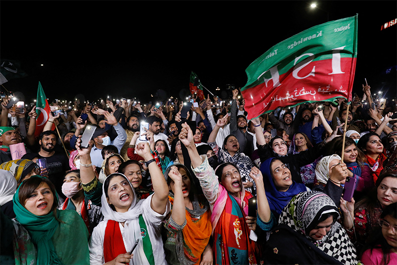 Supporters of the Pakistan Tehreek-e-Insaf (PTI) political party light up their mobile phones and chant slogans in support of Pakistani Prime Minister Imran Khan during a rally in Islamabad, Pakistan April 4, 2022. (AFP)