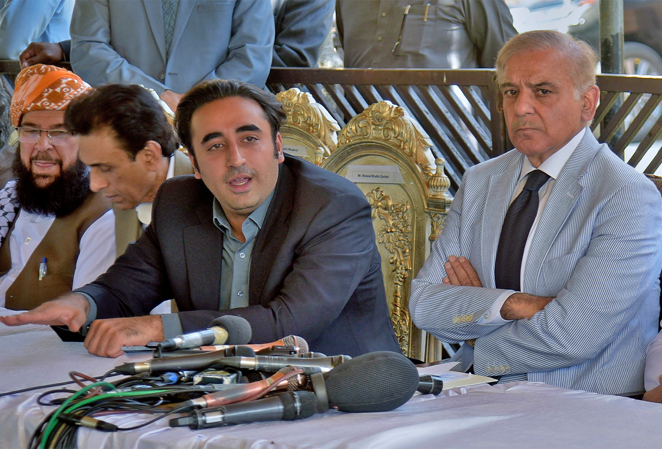 Pakistan opposition party leaders Bilawal Bhutto Zardari, center, and Shahbaz Sharif, right, give a press conference regarding current political situation, in Islamabad, Pakistan, on April 4, 2022. (AP)