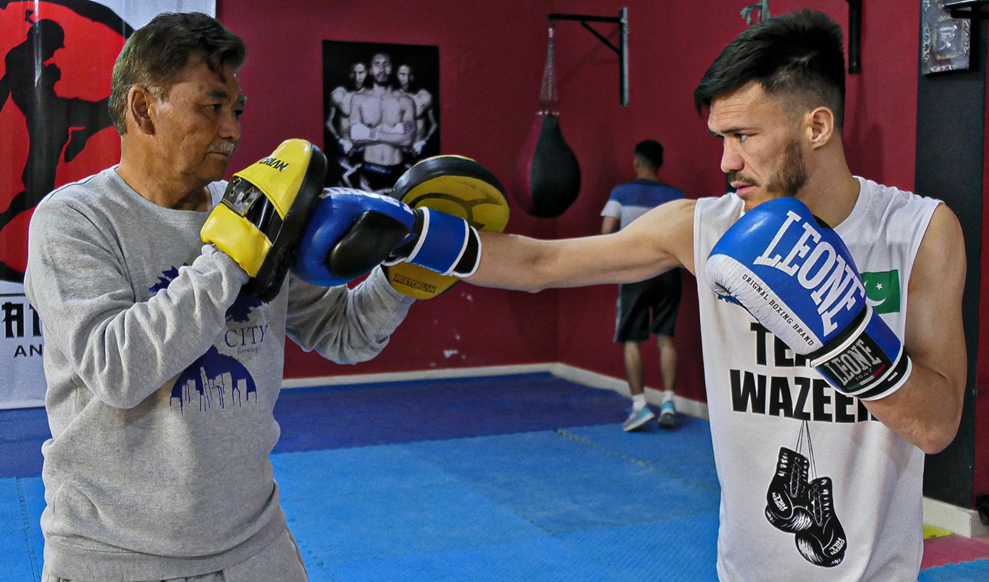 Syed Asif Ali Shah Hazara trains with his coach Hasratullah Changezi at Qayoum Papa Stadium in Quetta, Pakistan, on April 6, 2022. (AN photo)