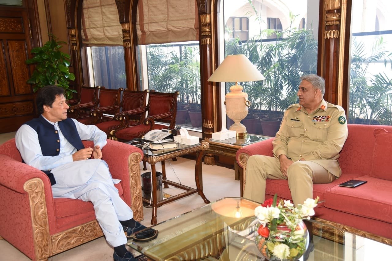 In this file photo, Pakistan's Prime Minister Imran Khan (L) meets Pakistani Army Chief Gen Qamar Javed Bajwa (R) in Islamabad on August 22, 2019. (Govt of Pakistan/ Twitter)