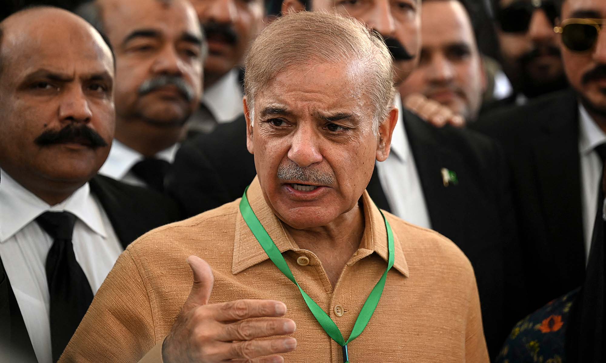 Shehbaz Sharif, center, speaks with the media before attending a hearing outside the Supreme Court building in Islamabad, Pakistan, on April 7, 2022. (AFP)