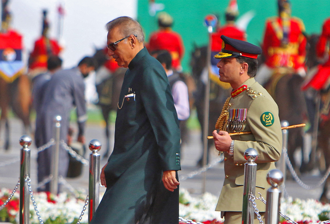 Pakistani President Arif Alvi (L) arrives to attend Pakistan Day parade in Islamabad, Pakistan, on March 23, 2022. (AFP/File)