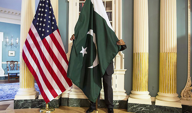A State Department contractor adjusts Pakistan national flag before a meeting at the State Department in Washington on February 19, 2015. (REUTERS/File)