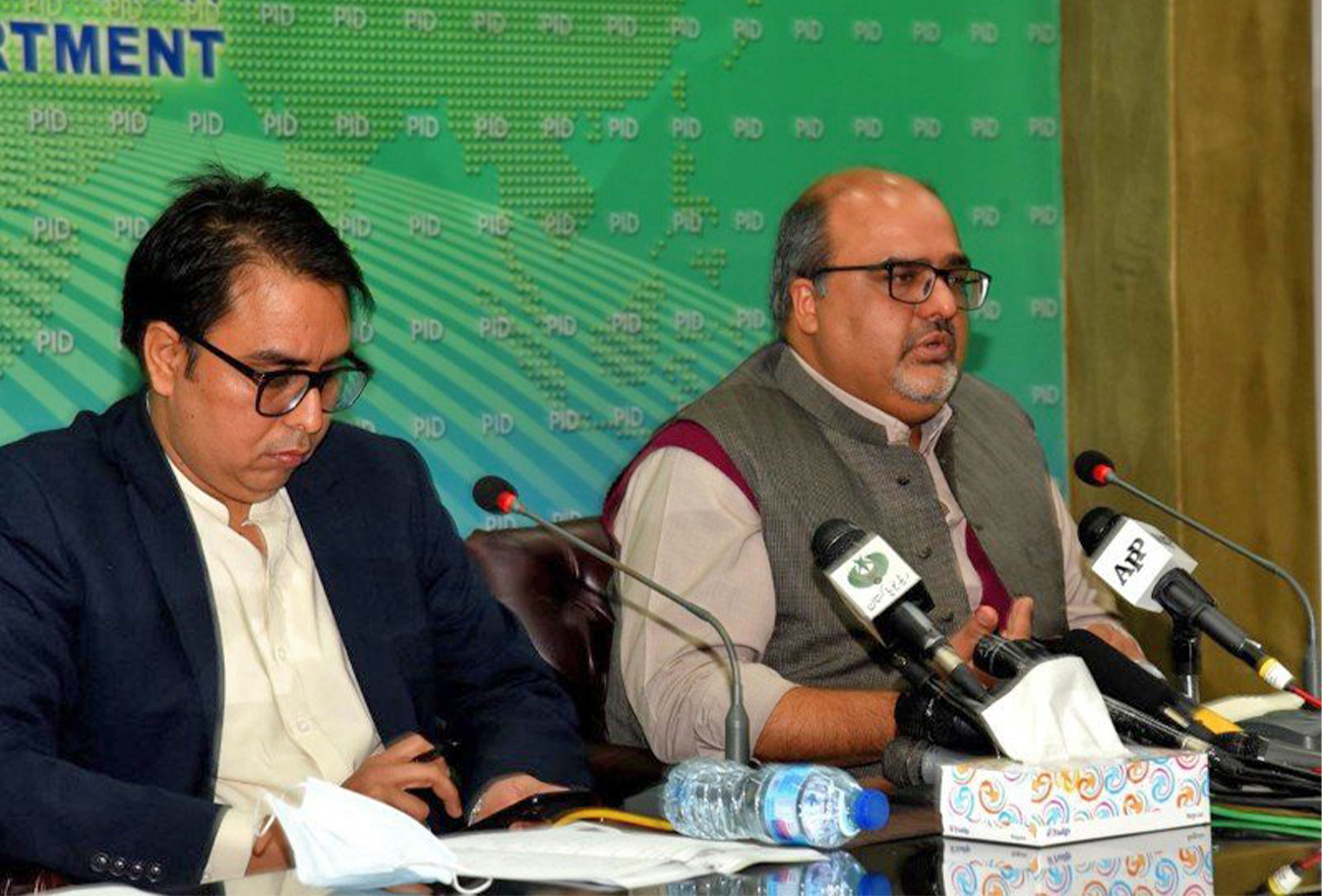 Advisers of former prime minister Imran Khan, Barrister Mirza Shahzad Akbar (right) and Dr. Shahbaz Gill are addressing a press conference in Islamabad, Pakistan, on December 2, 2020. (PID/File)