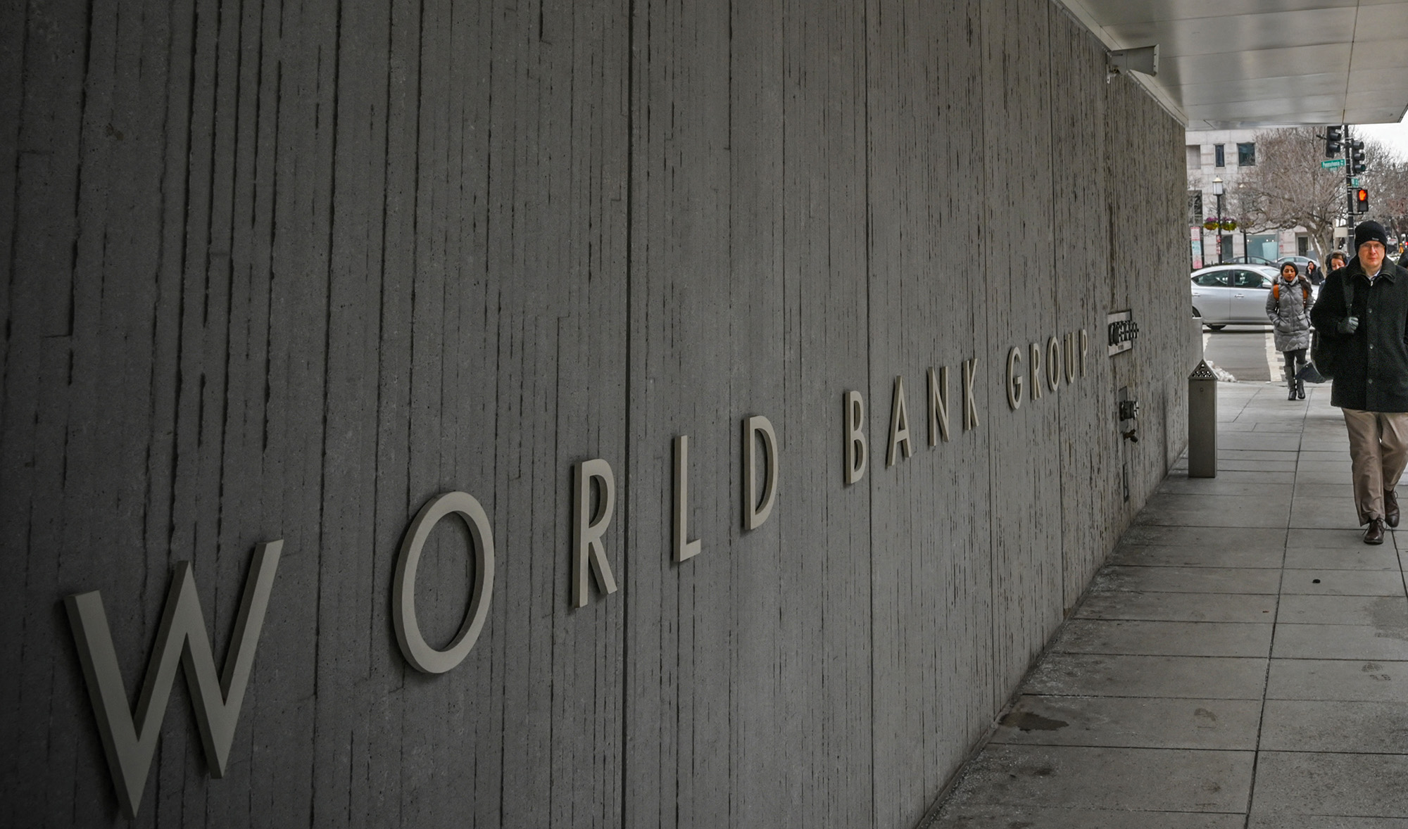 A person walks by the building of the Washington-based global development lender, The World Bank Group, in Washington DC, US on January 17, 2019. (AFP/File)