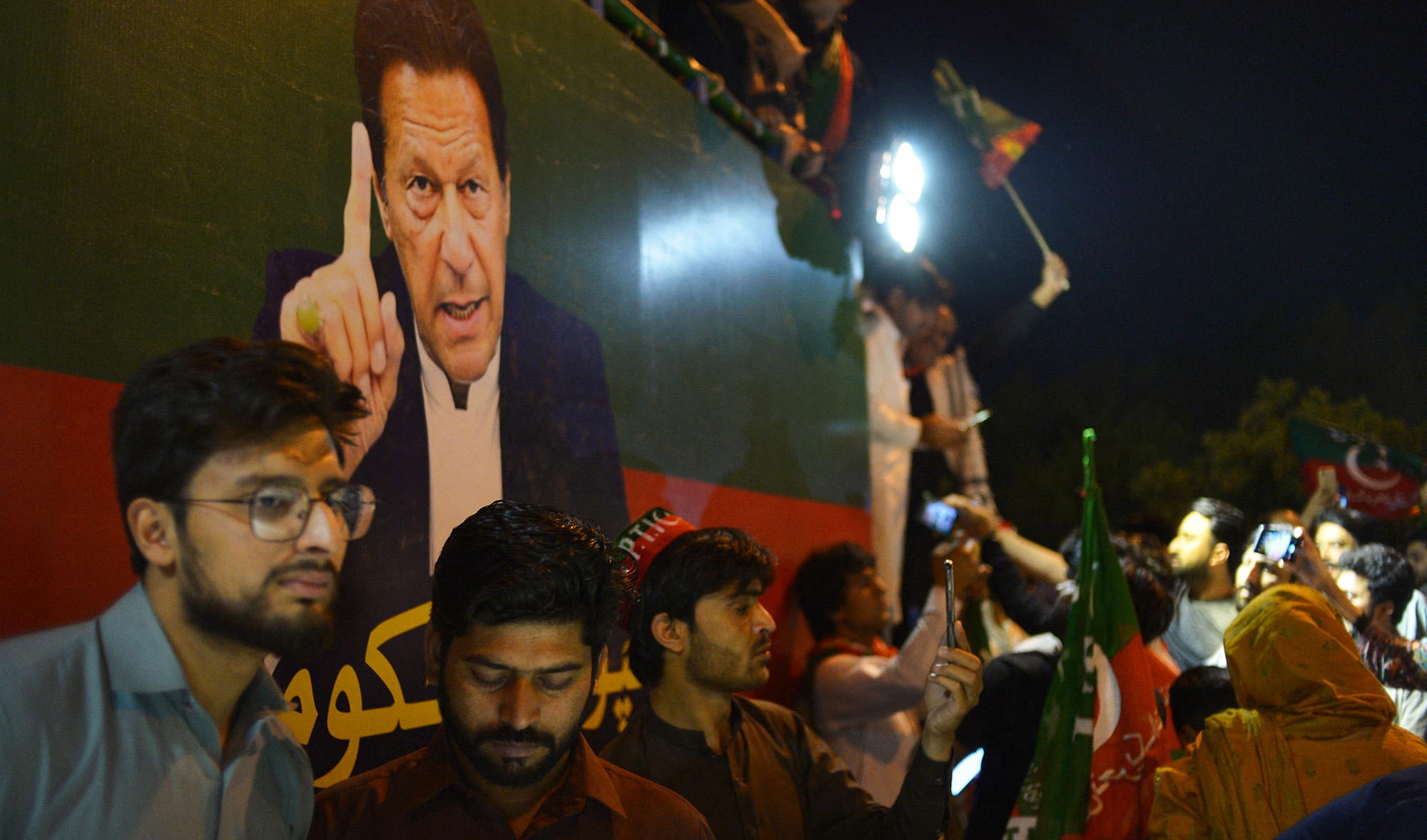 Supporters of Pakistan Tehreek-e-Insaf (PTI) party of dismissed Pakistan's Prime Minister Imran Khan, take part in a rally in his support in Islamabad on April 10, 2022. (AFP)
