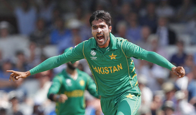 In this file photo, Pakistan's Mohammad Amir, right, celebrates after taking the wicket of India's captain Virat Kohli during the ICC Champions Trophy final cricket match between India and Pakistan at The Oval in London on June 18, 2017. (AFP)