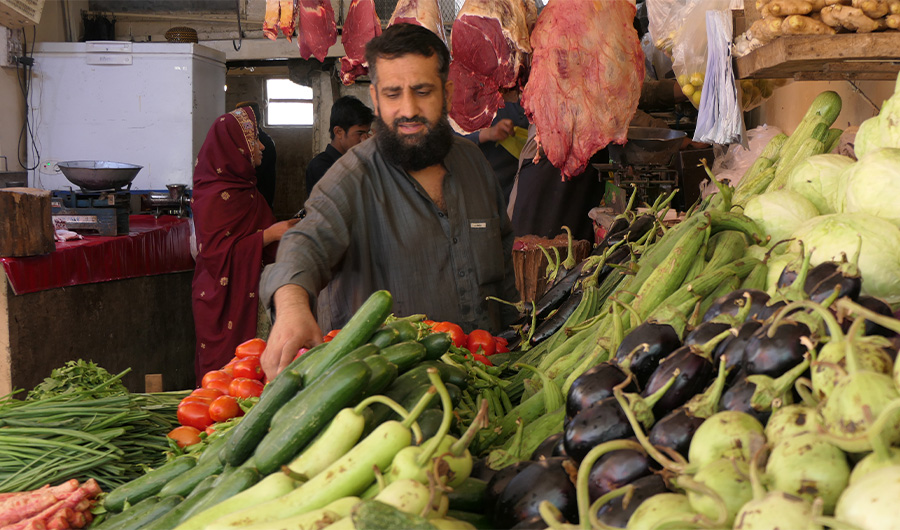 Haji Sultan Muhammad sells vegetables at his shop in the Sabzi Mandi vegetable market in Quetta, Pakistan, on April 20, 2022. (AN Photo)