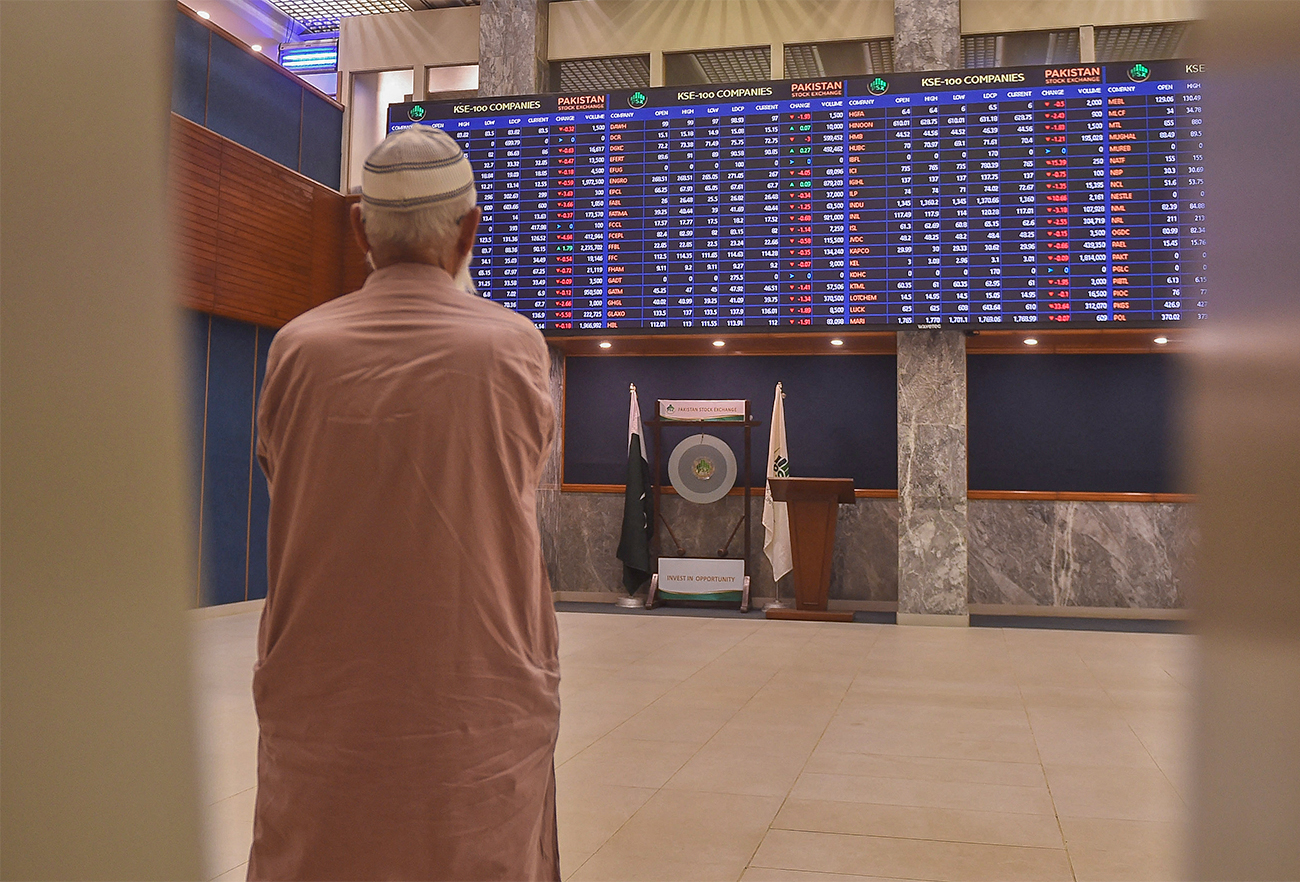 A stockbroker monitors the latest share prices during a trading session at the Pakistan Stock Exchange (PSX) in Karachi, Pakistan, on April 4, 2022. (AFP/File)