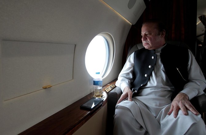 In this file photo, Pakistan's former Prime Minister Nawaz Sharif looks out the window of his plane after inaugurating the M9 motorway between Karachi and Hyderabad, Pakistan on Feb. 3, 2017. (REUTERS/FILE)