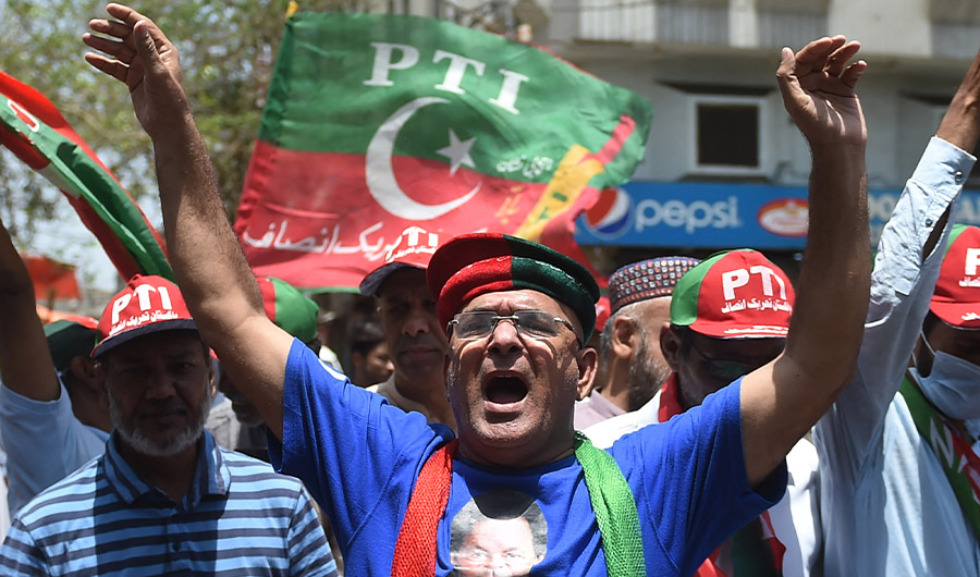 Supporters of the Pakistan Tehreek-e-Insaf (PTI) party of former prime minister Imran Khan protest against the Election Commission of Pakistan in Karachi on April 26, 2022. (AFP)