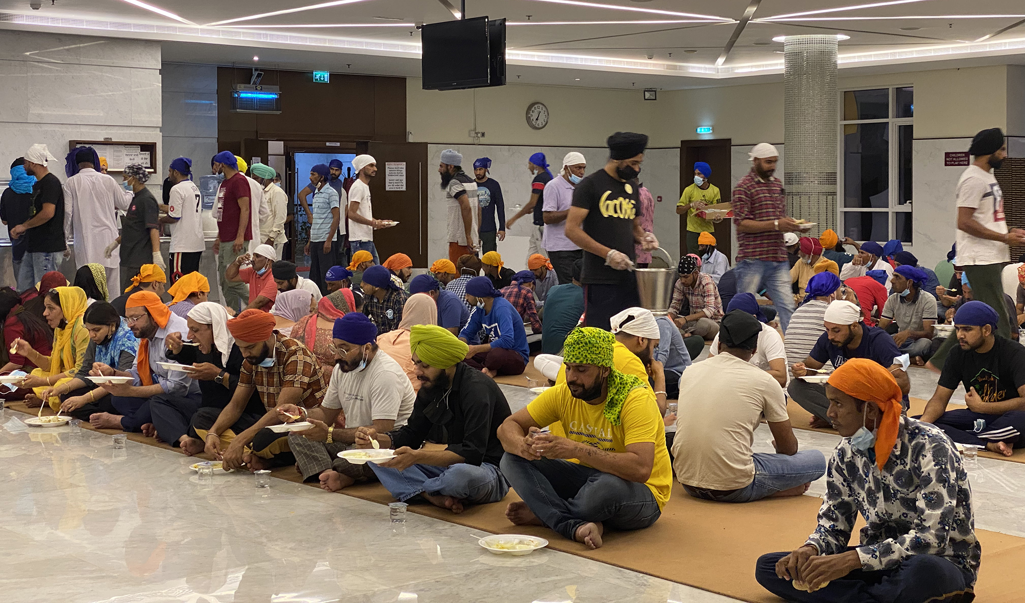 Sikh devotees wait for their food at the Guru Nanak Darbar Gurudwara in Dubai, United Arab Emirates, on April 26, 2022. (AN photo by Asma Ali Zain)