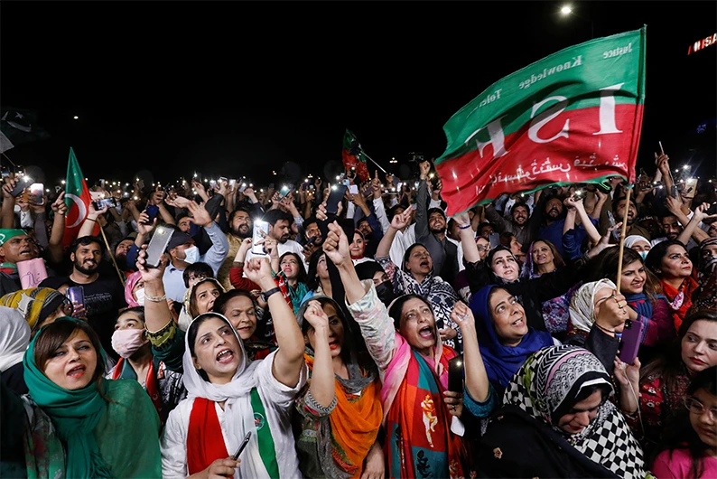 Supporters of the Pakistan Tehreek-e-Insaf (PTI) political party light up their mobile phones and chant slogans in support of Pakistani Prime Minister Imran Khan during a rally in Islamabad, Pakistan April 4, 2022. (AFP)