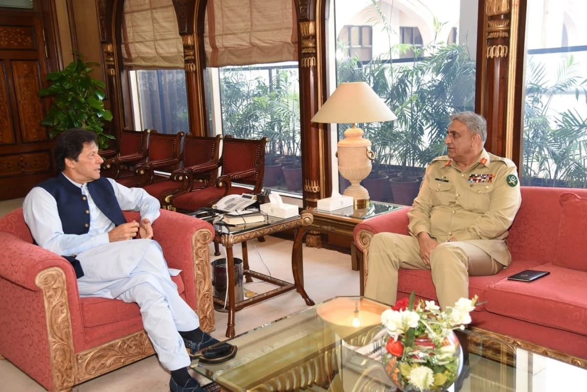 In this file photo, Pakistan's Prime Minister Imran Khan (L) meets Pakistani Army Chief Gen Qamar Javed Bajwa (R) in Islamabad on August 22, 2019. (Govt of Pakistan/ Twitter)