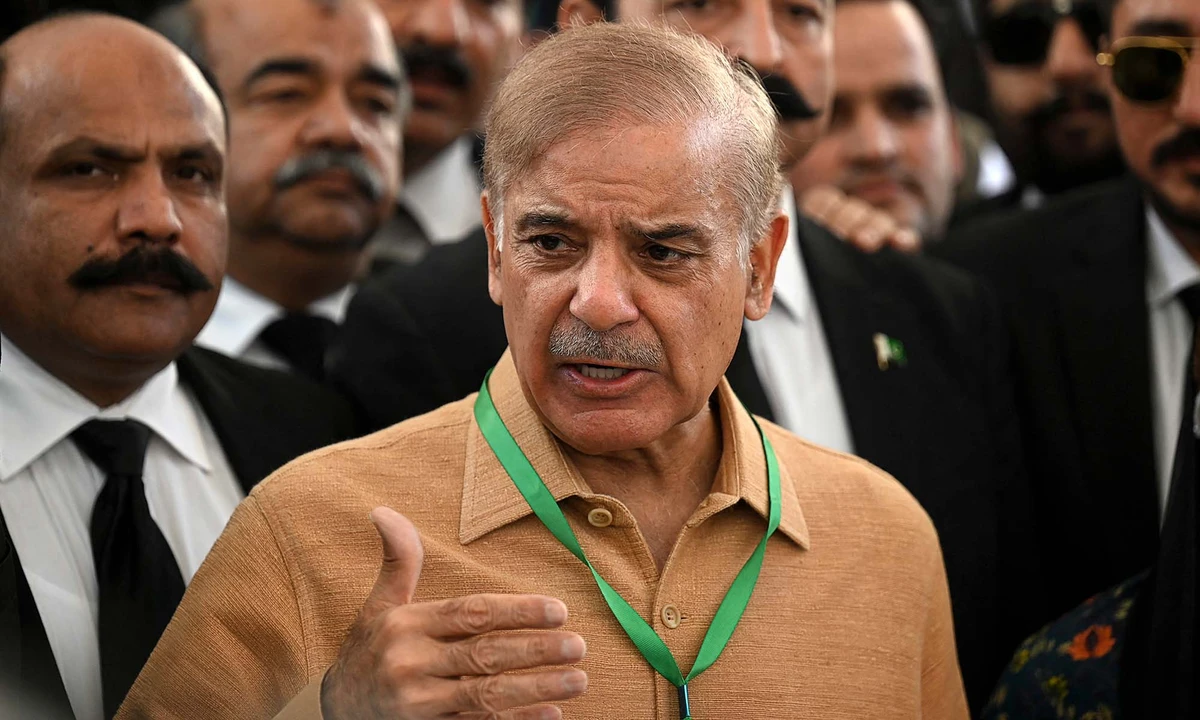 Shehbaz Sharif, center, speaks with the media before attending a hearing outside the Supreme Court building in Islamabad, Pakistan, on April 7, 2022. (AFP)