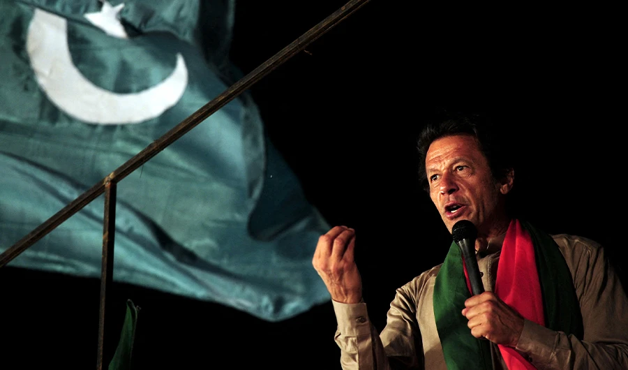 This file photo taken on September 1, 2014 shows Pakistani cricketer-turned-politician Imran Khan addressing supporters during an anti-government protest near the prime minister's residence in Islamabad. (AFP/FILE)