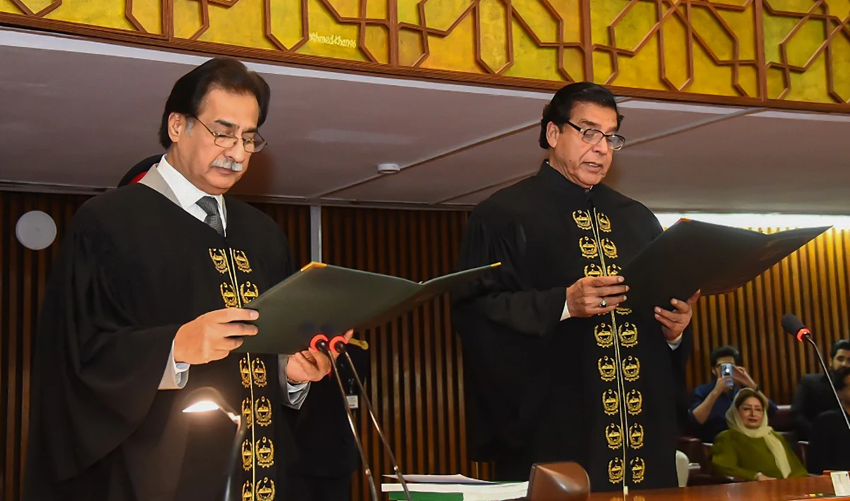 Pakistan Muslim League-Nawaz (PML-N) leader Ayaz Sadiq, left, administers oath to new National Assembly speaker Raja Pervaiz Ashraf in Islamabad, Pakistan, on April 16, 2022. (Photo courtesy: @NAofPakistan/Twitter)
