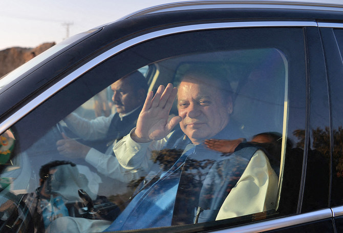 Former Pakistani prime minister Nawaz Sharif waves as he leaves an accountability court after a personal appearance to face corruption charges in Islamabad, Pakistan, on December 4, 2017. (AFP/File)