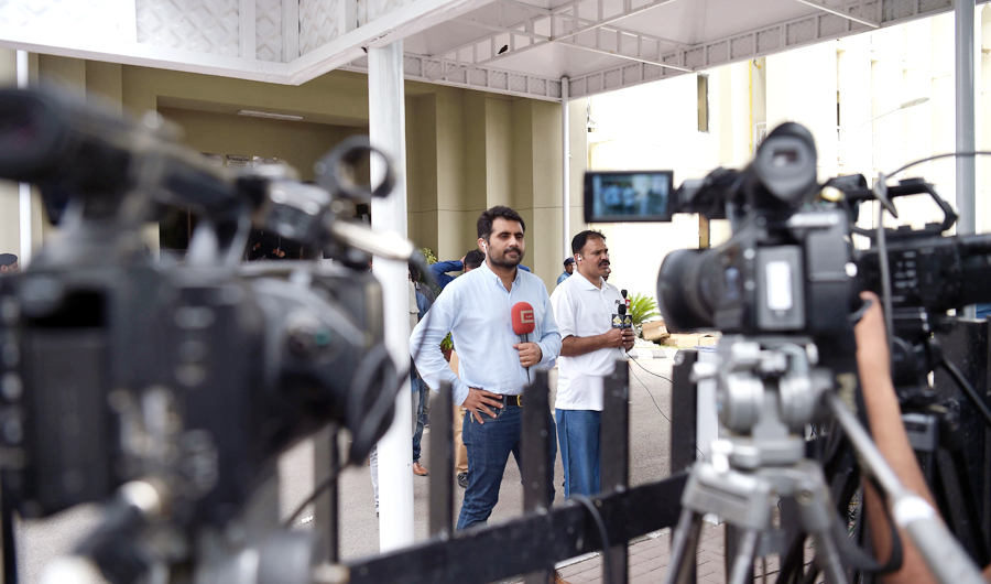 Pakistani journalists broadcast live news from the Supreme Court in Islamabad on June 28, 2018. (AFP/File)