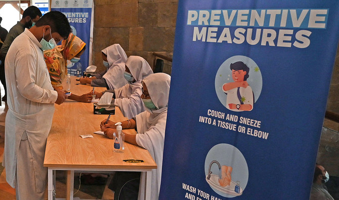 People register to get a dose of Covid-19 coronavirus vaccine at a mass vaccination centre in Islamabad, Pakistan on June 3, 2021. (AFP/File)