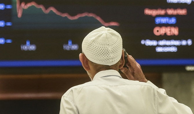 A stockbroker monitors the latest share prices during a trading session at the Pakistan Stock Exchange (PSX) in Karachi on February 24, 2022. (AFP/File)