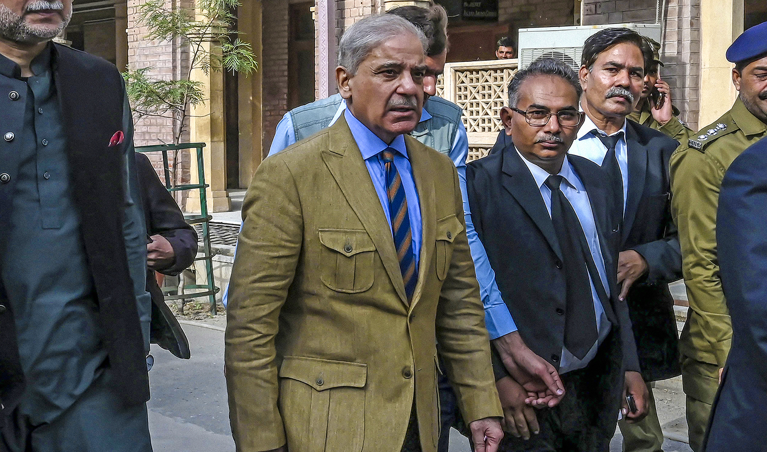 Pakistan Prime Minister Shehbaz Sharif, center, arrives at the High Court to attend a hearing in Lahore on November 16, 2019. (AFP/File)