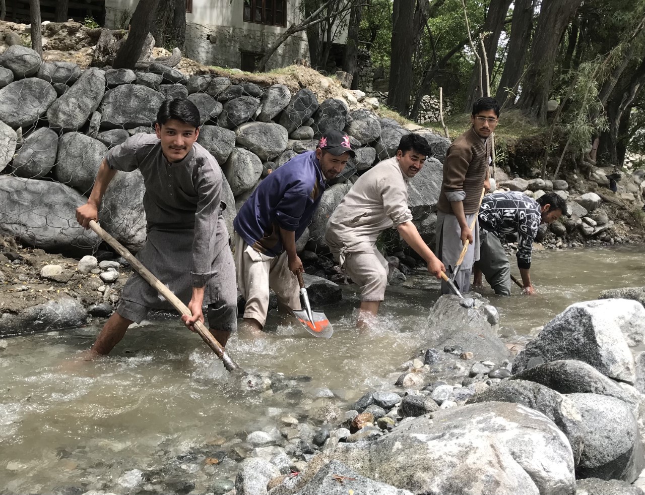 Villagers clean a water channel in Khaplu Valley of Gilgit-Baltistan, Pakistan, on May 7, 2022 (AN Photo)