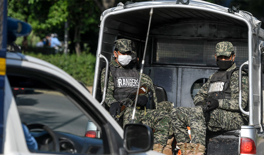 Security personnel patrol in vehicles on a street near I-8 residential sector in Islamabad on June 17, 2020. (AFP/FILE)