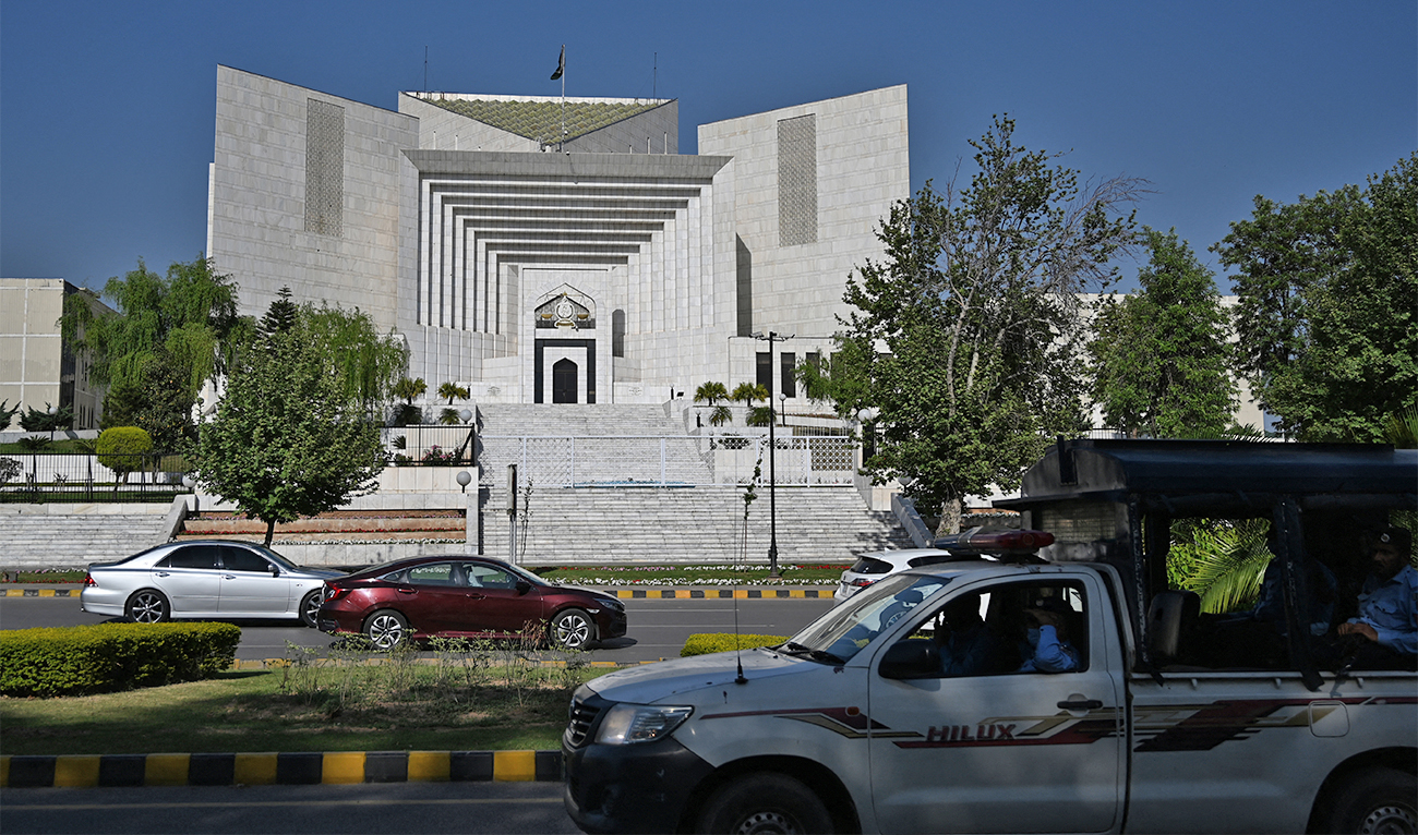 Motorists drive past Pakistan's Supreme Court in Islamabad on April 5, 2022. (AFP/File)