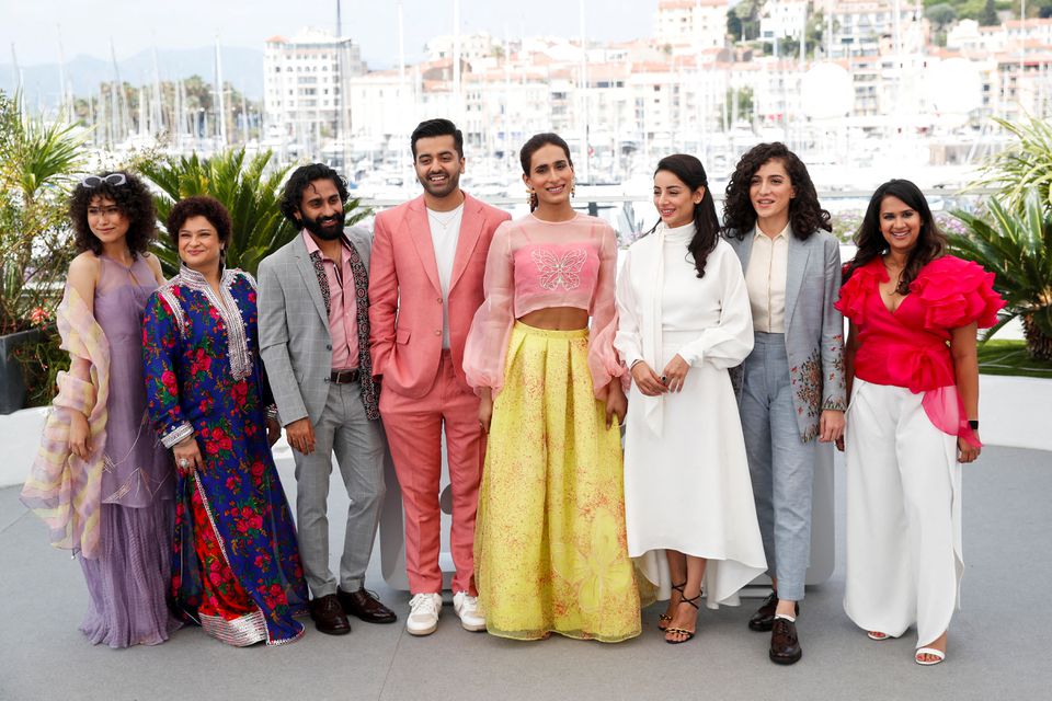 Pakistan film "Joyland" team poses for a photo at the 75th Cannes Film Festival in France, May 22, 2022. (REUTERS)