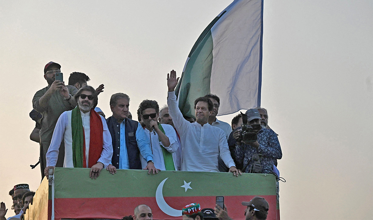 Pakistan's former prime minister Imran Khan, waves to supporters during a protest rally in Attock, Pakistan, on May 25, 2022. (AFP)
