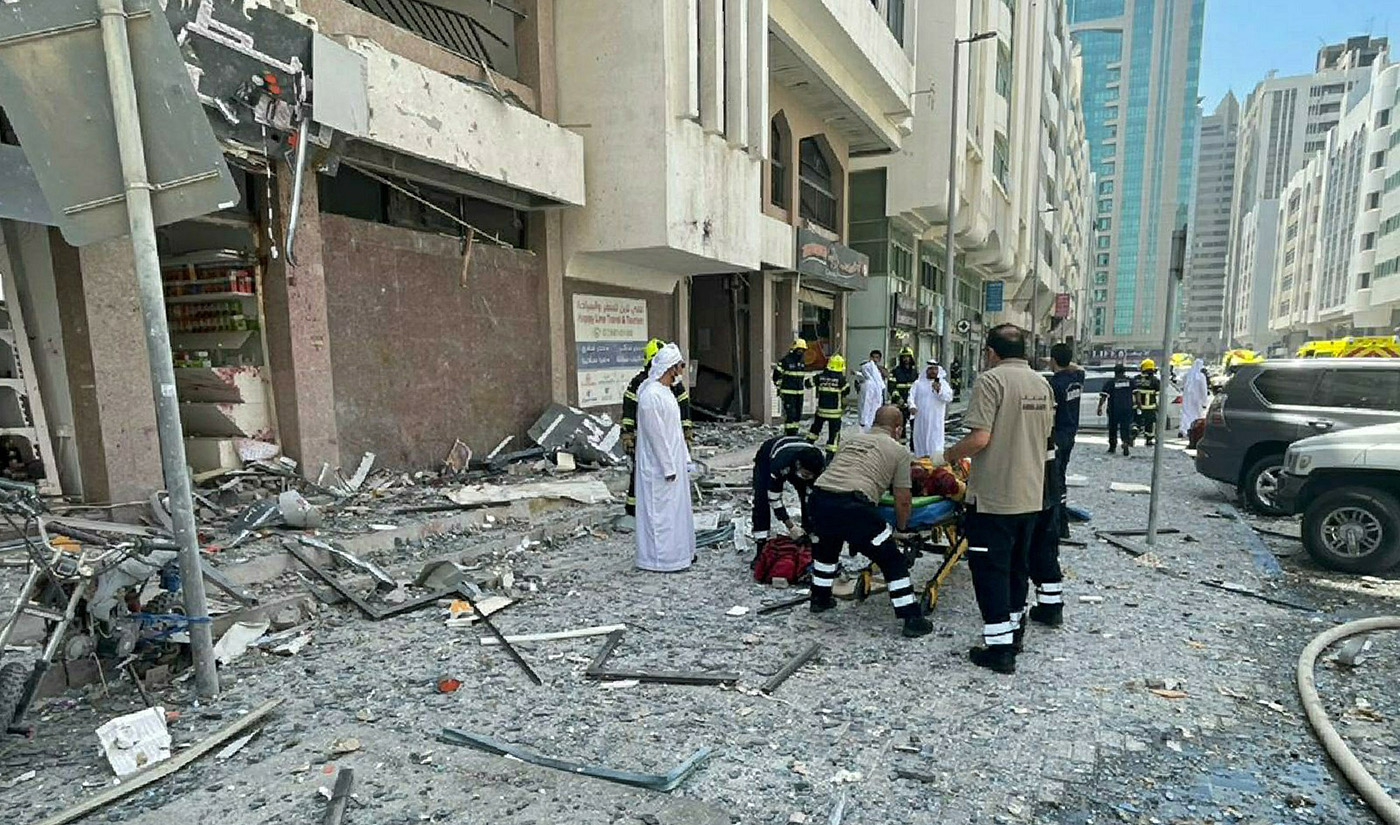 In this photo released by the Abu Dhabi Police, debris covers the street after an explosion in the Khalidiya district of Abu Dhabi, United Arab Emirates, Monday, May 23, 2022. (Abu Dhabi Police via AP)