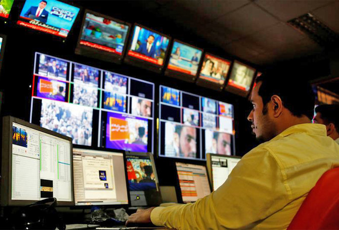 An employee works at the control room of a television channel in Karachi, Pakistan, on April 11, 2018. (REUTERS/File)