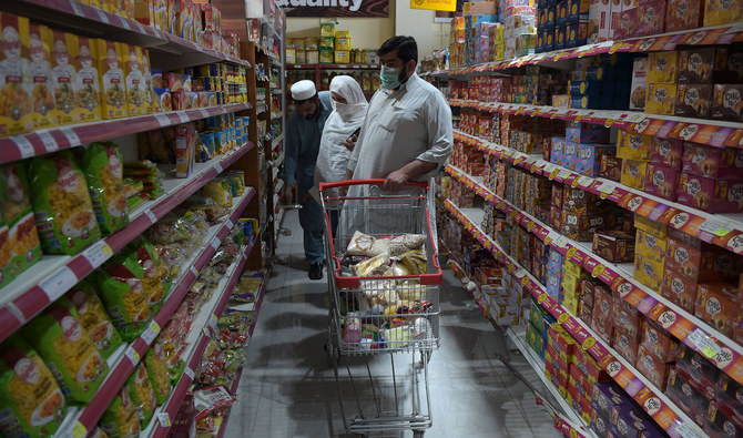 In this file photo, residents buy food items at a store in Peshawar on April 21, 2020. (AFP/FILE)