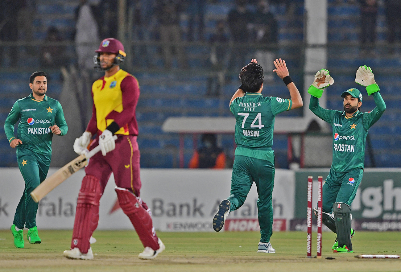 Pakistan's Mohammad Wasim (2R) celebrates with teammates after taking the wicket of West Indies' Brandon King (2L) during a T20I cricket match in Karachi, Pakistan, on December 16, 2021. (AFP/File)